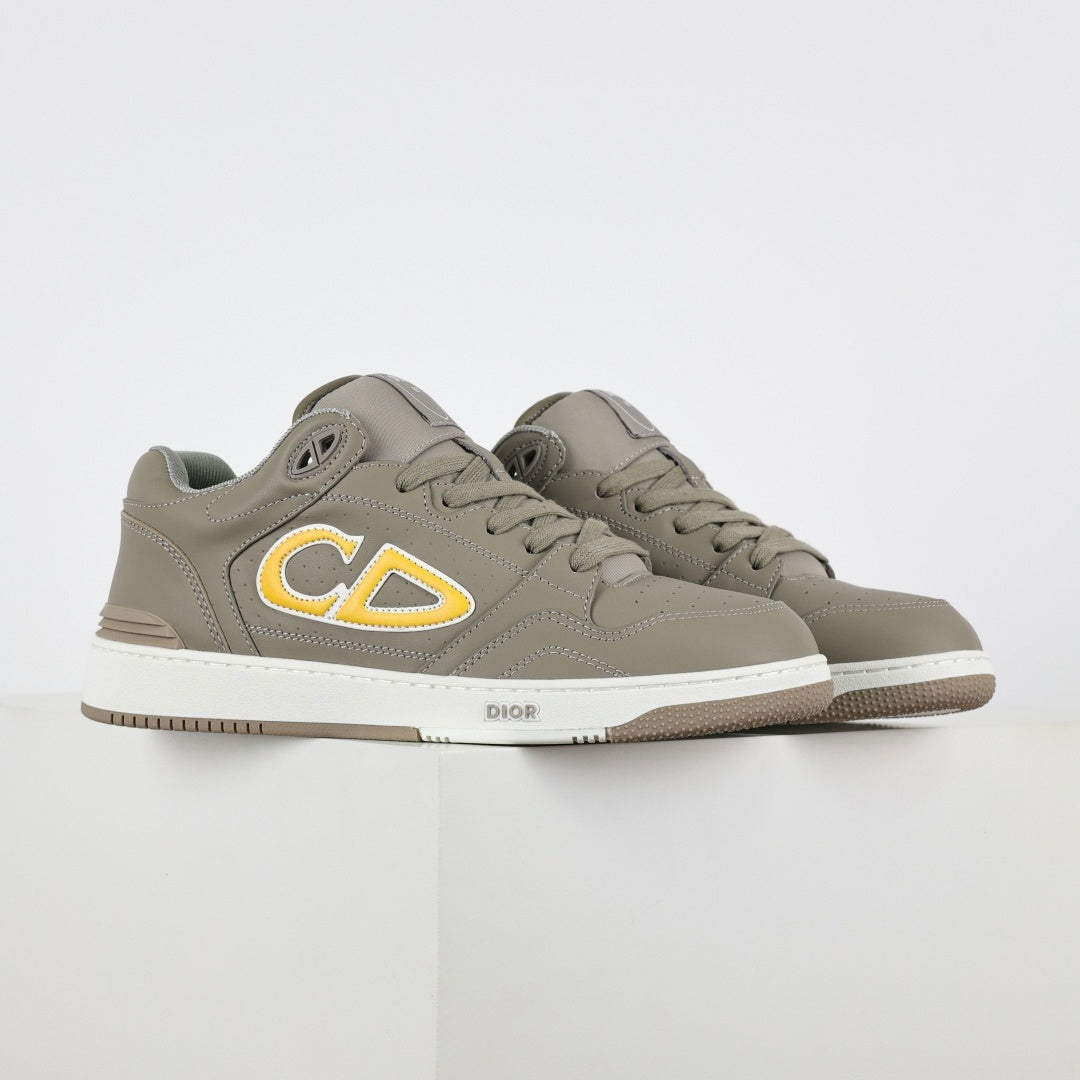 B57 Low-Top Sneakers in Taupe with Yellow CD Signature