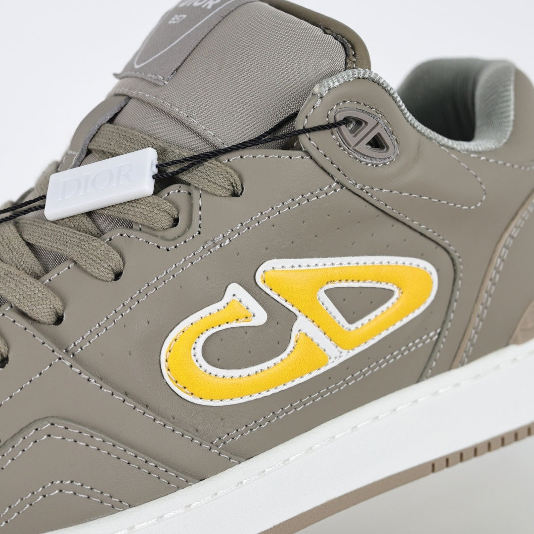 B57 Low-Top Sneakers in Taupe with Yellow CD Signature